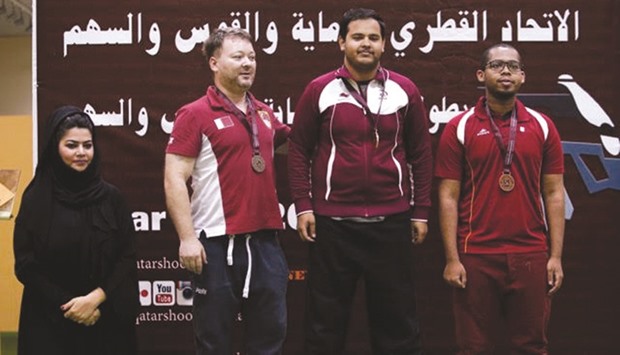 Ali Rashid al-Muhannadi (second from right) won the menu2019s 50m Rifle Prone event in the Qatar Cup at the Losail Shooting Range yesterday.