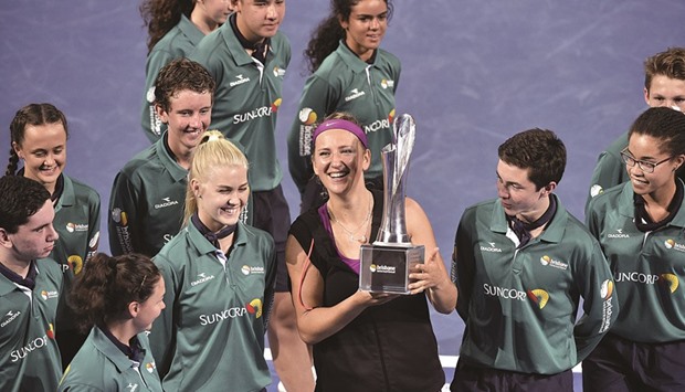  Victoria Azarenka of Belarus lifts the winneru2019s trophy after defeating Angelique Kerber of Germany in the final of the Brisbane International yesterday. (AFP)