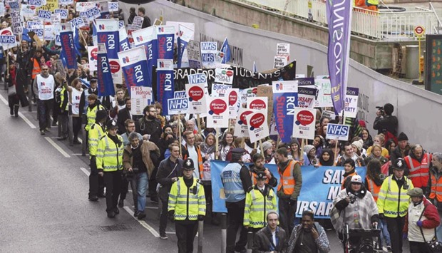 Protesters take part in a demonstration against the proposed cancellation of bursaries for student nurses in London yesterday.