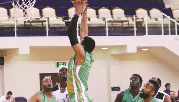 Action from the Qatar Basketball League match between Al Sadd and Al Ahli yesterday.