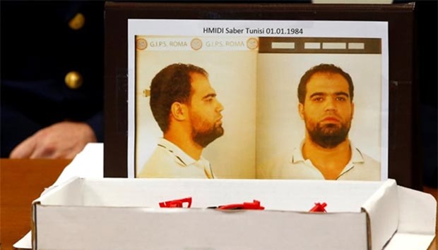 A mugshot of Saber Hmidi is seen at a news conference at the police headquarters in Rome on Tuesday.