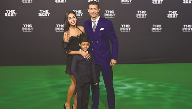 Real Madrid forward Cristiano Ronaldo with partner Georgina Rodriguez and son Cristiano Ronaldo Jr at the FIFA Awards ceremony in Zurich on Monday. (AFP)