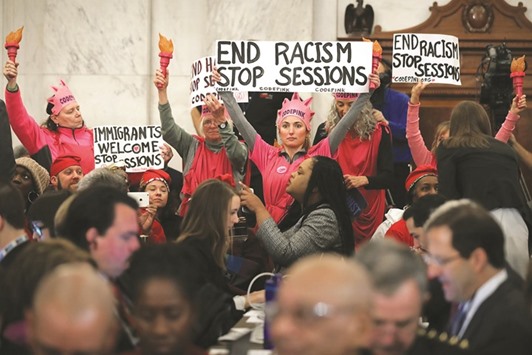 Members of Code Pink for Peace protest against Sessions during his confirmation hearing before the Senate Judiciary Committee in the Russell Senate Office Building on Capitol Hill.