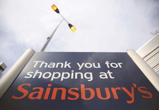 A Sainsburyu2019s signboard is seen in London. Shares in the supermarket chain jumped 4% after it posted rising sales over the key Christmas period.