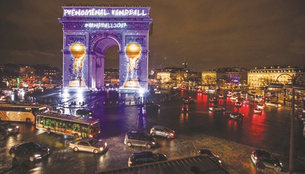 The Arc de Triomphe in Paris is illuminated with images of the 25th World Handball Championship.