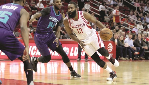 Houston Rockets guard James Harden (right) drives past Charlotte Hornets forward Michael Kidd-Gilchrist (centre) during the first quarter of the NBA game at Toyota Center in Houston, Texas, on Tuesday. (USA TODAY Sports)