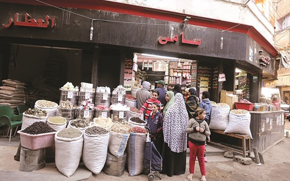Customers buy natural herbal drugs in Cairo.