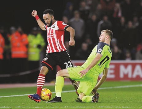 Southamptonu2019s Nathan Redmond vies for the ball with Liverpoolu2019s Ragnar Klavan during the League Cup match on Wednesday night. (Reuters)