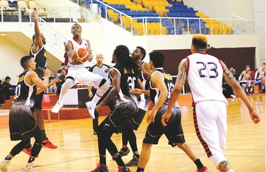 Top scorer Marcel Anderson of Al Rayyan goes for a basket against Al Sadd yesterday.