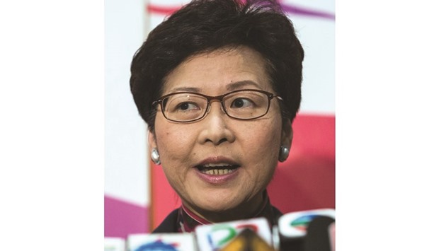Carrie Lam speaks at a press conference to announce her resignation from the Legislative Council in anticipation of running for Chief Executive in Hong Kong.