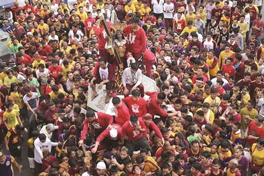 Devotees join a thanksgiving procession ahead of the Black Nazarene feast on January 9, which is expected to draw millions.