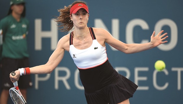 Alize Cornet of France plays a forehand return during her win over Elena Vesnina of Russia in the first round of the Brisbane International tennis tournament, yesterday.  (AFP)