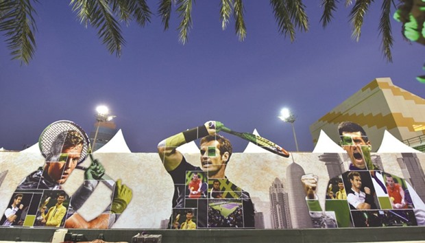 Tennis stars Tomas Berdych, Andy Murray and Novak Djokovic adorn a poster at the Khalifa International Tennis and Squash Complex where the 25th edition of the Qatar ExxonMobil Open will begin today.