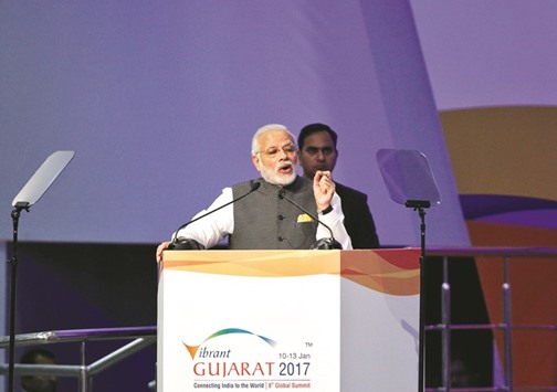 Indiau2019s Prime Minister Narendra Modi addresses the delegation at the Vibrant Gujarat investor summit in Gandhinagar. Business leaders from around the world attending the summit said Modiu2019s reforms have helped turn India into the worldu2019s fastest growing major economy, albeit with the help of hefty government spending to fund projects.
