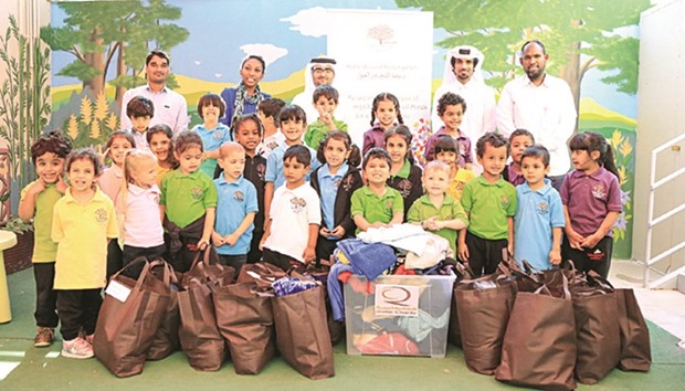 Students donate used clothes to Qatar Charity.