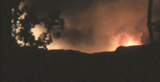 Smoke and flames are seen near Mezzah military airport, near Damascus, Syria, in this still image from video obtained by Reuters yesterday.