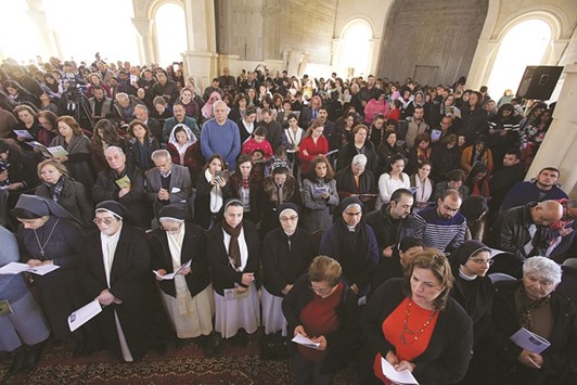 Catholic pilgrims attend a special mass yesterday, at St John the Baptist Catholic church, on the Jordanian side of the Jordan River in an annual pilgrimage to the site.
