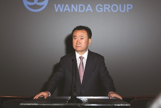 Wang Jianlin speaks at a press conference in Los Angeles. Wanda sales, which includes property-contracted sales, declined 14% in 2016 from a year earlier, according to a company statement yesterday.