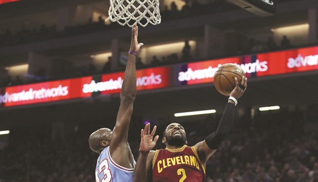 Kyrie Irving (R) of the Cleveland Cavaliers goes up for a shot on Anthony Tolliver of the Sacramento Kings at Golden 1 Center in Sacramento, California. (Getty Images/AFP)