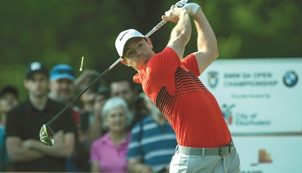 Rory McIlroy stays in contention in South African Open despite back pain.
