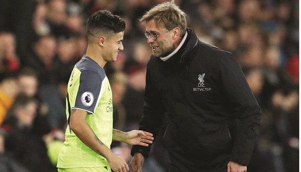 Liverpool manager Juergen Klopp (right) has been lifted by the return to fitness of Brazilian playmaker Philippe Coutinho, who returned from an ankle problem at Southampton for the League Cup semifinal at St Maryu2019s Stadium. (Reuters)