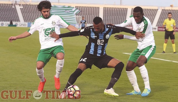 Ahmad Koheyl (centre) of Al Wakrah attempts to get past Al Wakrah defenders during the  QSL match at the Al Wakrah Stadium yesterday. PICTURE: Jayan Orma