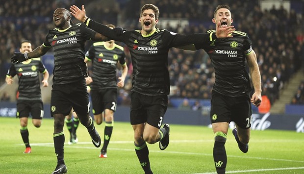 Chelseau2019s Marcos  Alonso (C) celebrates scoring their second goal with Gary Cahill and Victor Moses.