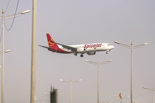 A SpiceJet aircraft prepares to land at Chhatrapati Shivaji International Airport in Mumbai. SpiceJet, Indiau2019s fourth biggest airline with a 13% market share, said on Friday it was buying up to 205 Boeing planes worth $22bn to fuel a major expansion of its domestic operations.