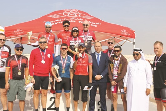 Winners celebrate on the podium after the fifth round of the Royal Air Maroc Cycling League.