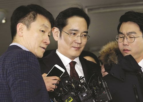 Jay Y Lee, centre, vice chairman of Samsung Electronics, at the office of independent counsel in Seoul, where he was questioned as a suspect in bribery case that led to the presidentu2019s impeachment.