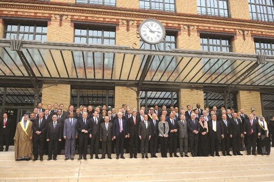 Foreign ministers and representatives of various countries pose for a group photo during the Mideast peace conference in Paris yesterday.