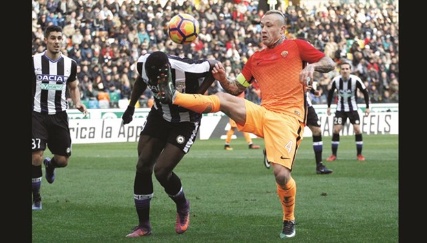 AS Romau2019s Radja Nainggolan (right) gets past Udineseu2019s Duvan Zapata during the Italian Serie A match at Dacia Arena stadium in Udine Italy. (Reuters)