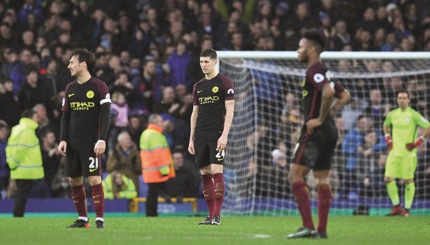 Manchester City players react to their loss to Everton after their EPL match at Goodison Park yesterday. (AFP)