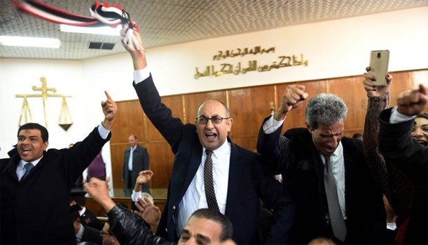 Egyptian lawyer and former presidential candidate Khaled Ali (C) celebrates after the Supreme Administrative Court upheld a ruling voiding a government agreement to hand over two Red Sea islands to Saudi Arabia