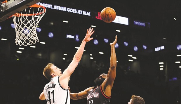 Brooklyn Nets centre Justin Hamilton (R) defends against a shot by Houston Rockets guard James Harden during the NBA game at Barclays Centre. PICTURE: USA TODAY Sports