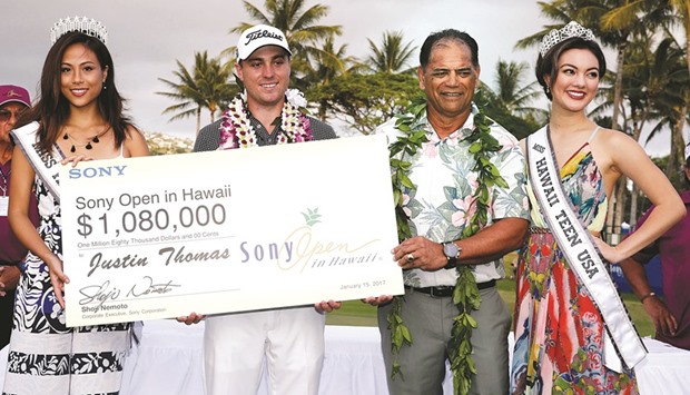 Justin Thomas accepts the check after winning the Sony Open golf tournament at Waialae Country Club. PICTURE: USA TODAY Sports