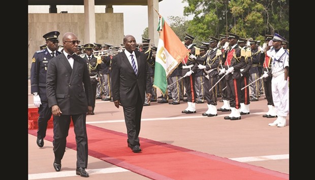 Ivorian Vice-President Daniel Kablan Duncan reviews an honour guard after his swearing-in ceremony in front of the Constitutional council in Abidjan.