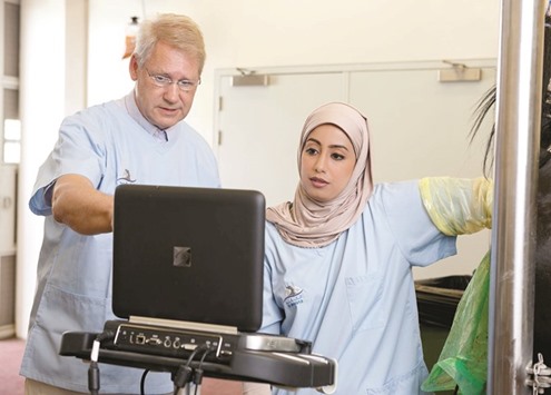 EXAM: Dr Troedsson and Qatari veterinarian Dr Muneera al-Fadala conducting an ultrasonographic examination of a mareu2019s reproductive tract.
