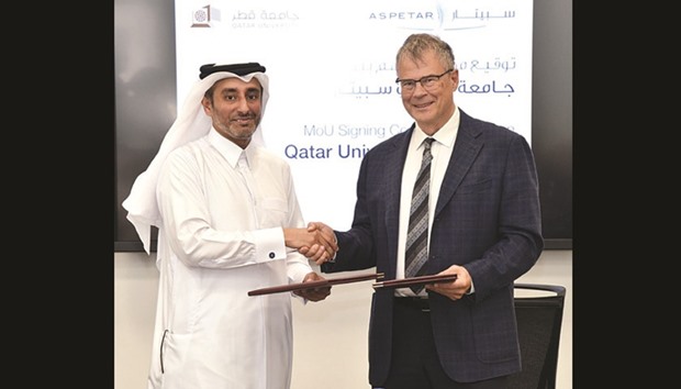 Dr Egon Toft and Dr Mohamed Ghaith al-Kuwari shake hands after signing the MoU.