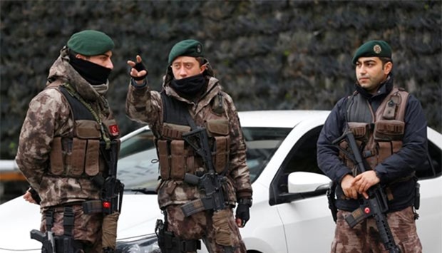 Members of the Turkish police special forces stand guard at the police headquarters in Istanbul on Tuesday.