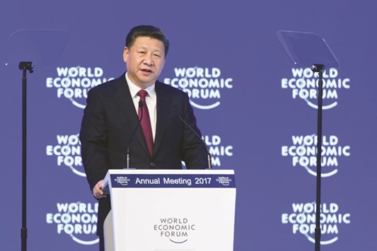 Chinau2019s President Xi Jinping delivering a speech during the first day of the World Economic Forum in Davos yesterday. u201cProtectionism is like locking yourself in a dark room, which would seem to escape wind and rain, but also block out the sunshine. No one is a winner in a trade war,u201d Xi said.