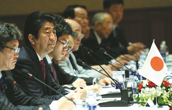 Japanese Prime Minister Shinzo Abe (centre) attends the Vietnam-Japan Business forum also attended by Vietnamese Prime Minister Nguyen Xuan Phuc in Hanoi yesterday. Japanese firms are currently involved in more than 3,000 projects worth roughly $42bn in Vietnam, mostly in the manufacturing sector.