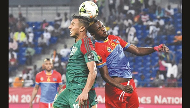 Democratic Republic of the Congou2019s midfielder Merveille Bokadi (right) and Moroccou2019s forward Aziz Bouhaddouz go for a header during the 2017 Africa Cup of Nations Group C match in Oyem, Gabon on Monday night. Congo won 1-0. (AFP)