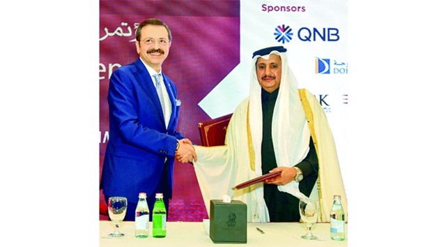 Sheikh Khalifa and Hisarc?kl?o?lu shake hands after signing a cooperation agreement at the opening of the u20182nd SMEs Conferenceu2019 yesterday. PICTURE: Noushad Thekkayil