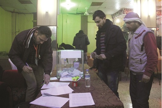 Syrians cast their vote at a polling station in the city of Idlib as they elect the cityu2019s first civilian council, two years after it was overrun by rebels and militants yesterday.
