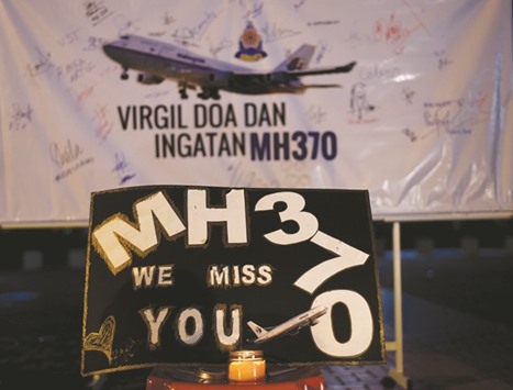 A board bearing solidarity messages during a gathering to mark the one-year anniversary of the disappearance of Malaysia Airlines flight MH370 in Kuala Lumpur.