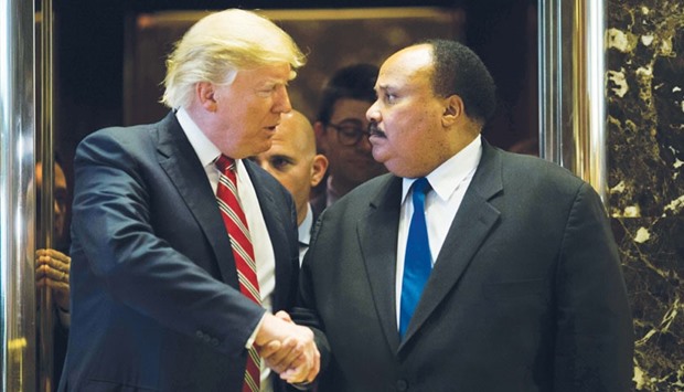 President-elect Donald Trump shakes hands with Martin Luther King III at Trump Tower in New York City.