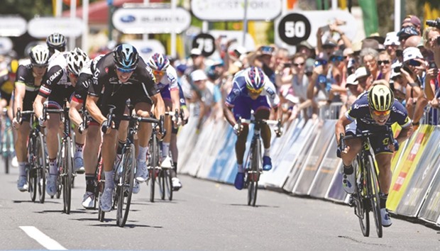 Australian cyclist Caleb Ewan (right) of team Orica-Scott finishes ahead of Team Skyu2019s Dutch cyclist Danny Van Poppel (front left) in the first stage of the Tour Down Under cycling race from Adelaide to Tanunda yesterday. (AFP)