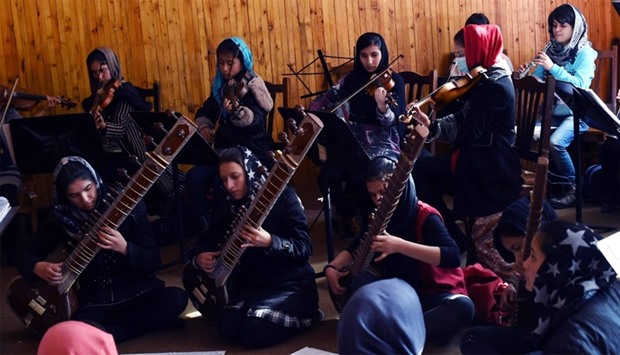Afghan music students play during a rehearsal at The Afghanistan National Institute of Music in Kabul
