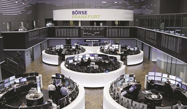 Traders at the Frankfurt Stock Exchange. The DAX 30 gained 0.5% at 11,599.39 yesterday.